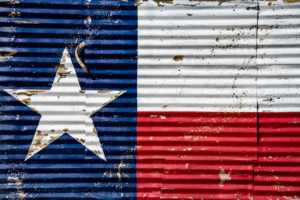 A mural of the Texas flag seen on a corrugated tin wall in Dripping Springs.