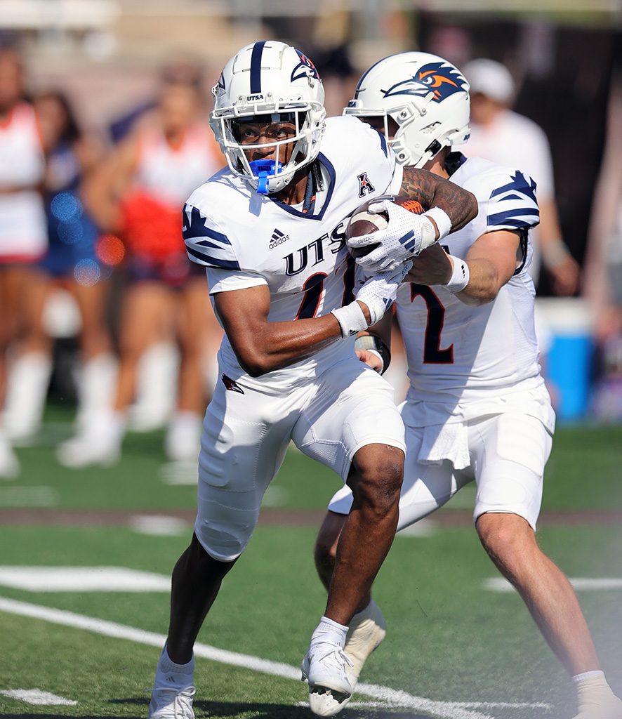 A closely cropped image of two football players.