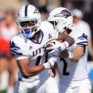 A closely cropped image of two football players.